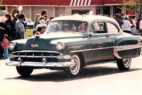 My first car was a 1954 Chevy 4door sedan Faded green with dulling cream 