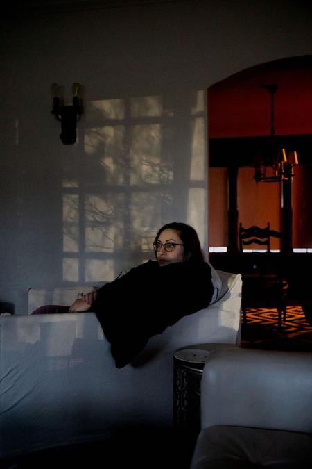 My roommate, Laura, reads on her favorite chair as the blues and oranges of the night light cast a glow around her. Quiet seems to take on different colors lately.Taken by Amy Sacka for WDET