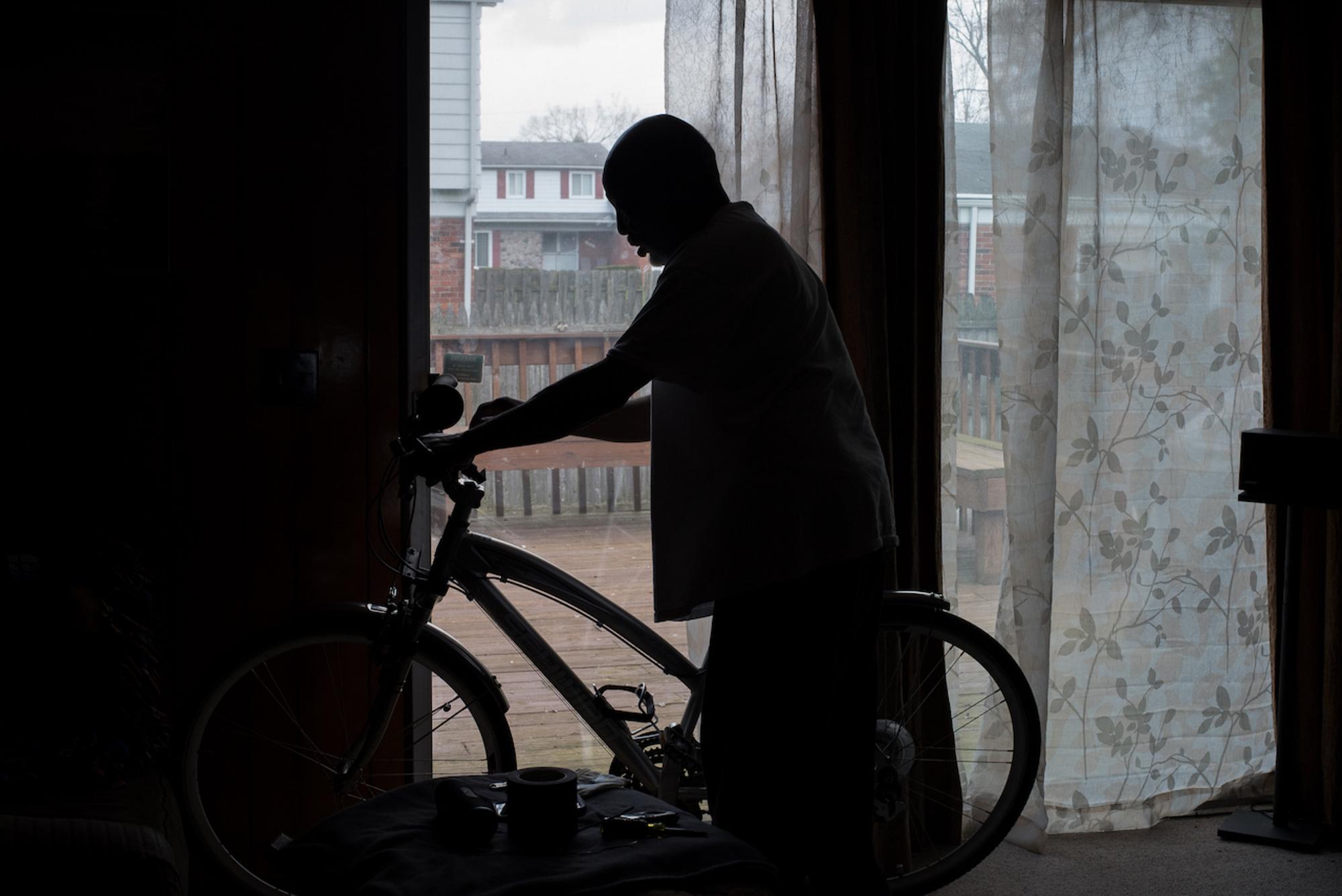 My dad, Stanley Thomas has several bicycles that he has found, repaired and has made his own personal customizations to. He also gives bikes away to people who are in need of one. Here, he makes alterations to one of his bicycles in our family room at our home.Taken by Rachel Elise Thomas for WDET