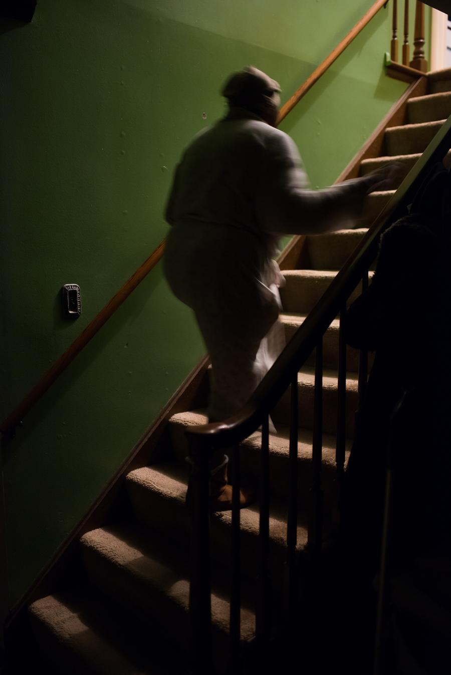 My mother, Michelle Nunn-Thomas walks up the stairs at our home.Taken by Rachel Elise Thomas for WDET