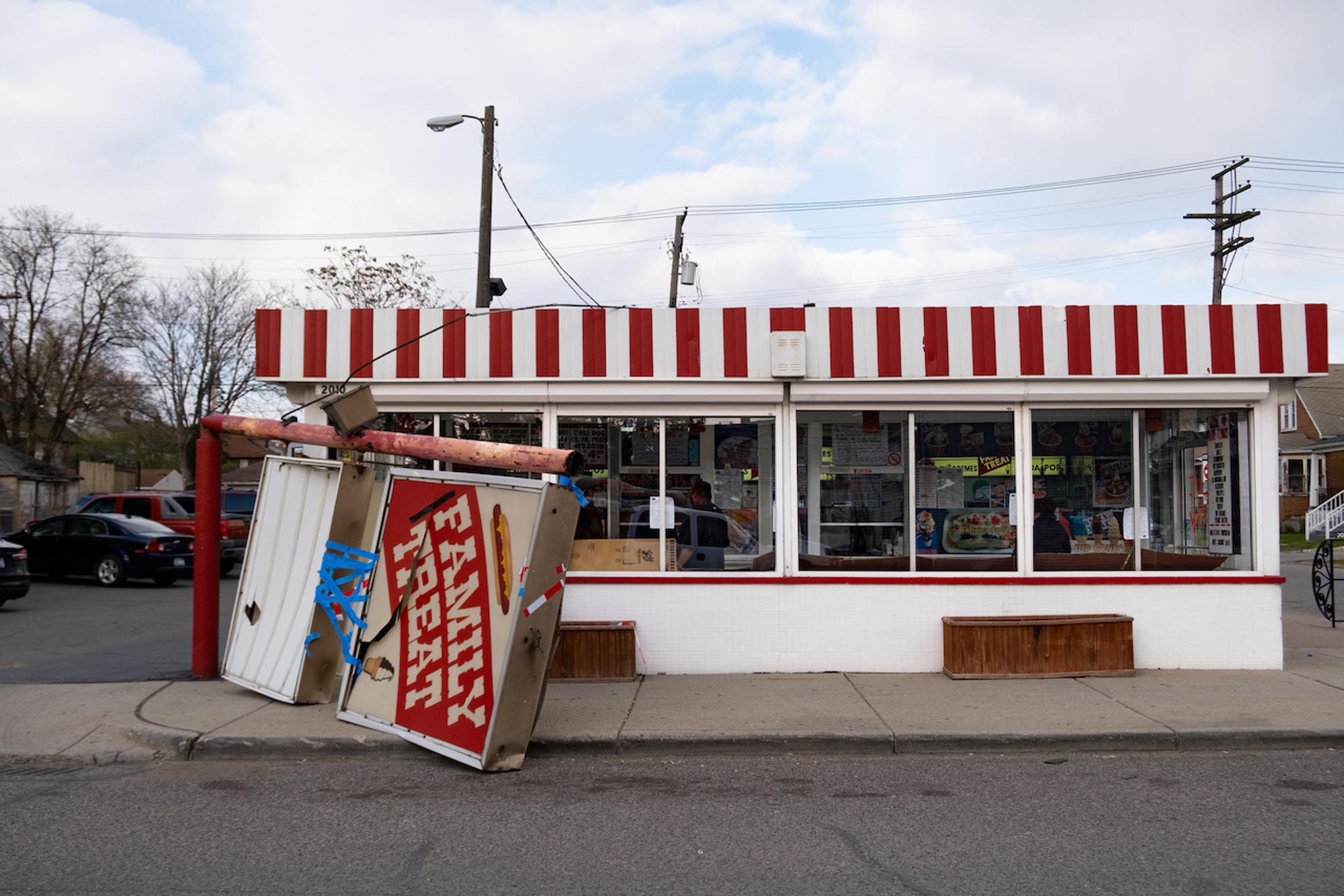 The Family Treat sign was knocked over in high winds during the local favorite ice parlor's annual opening today.Taken by Erik Paul Howard for WDET