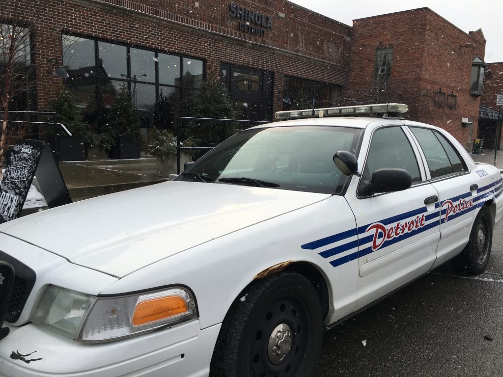 white police car with blue and red decorations