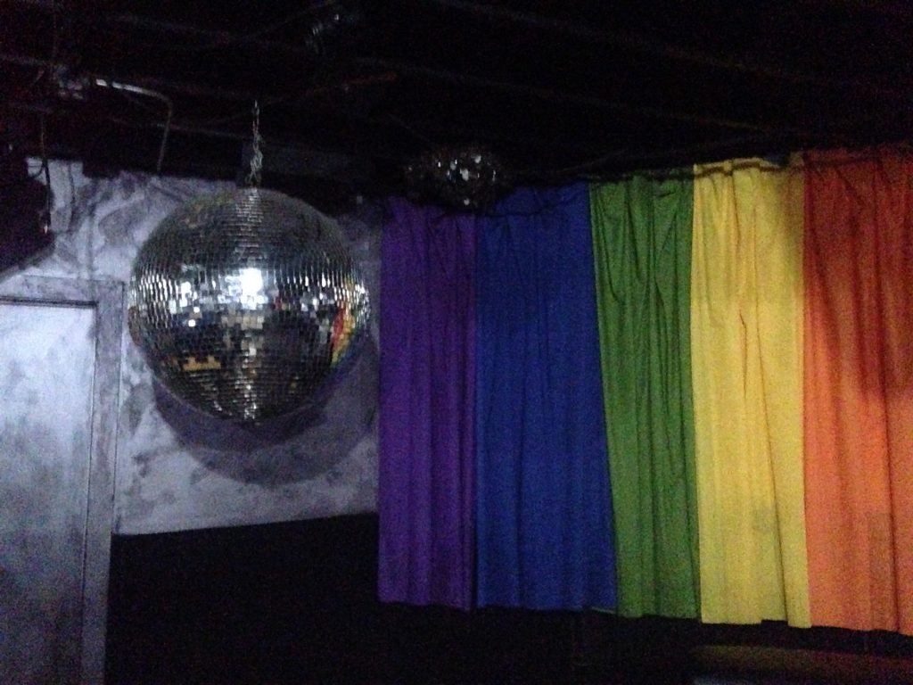 pride flag and disco ball