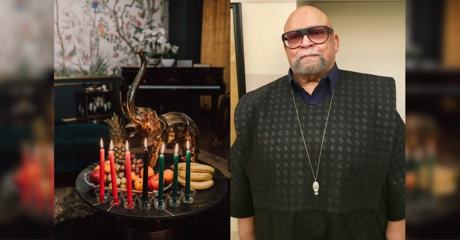 red, black and green candles and fruit next to a picture of Maulana Karenga