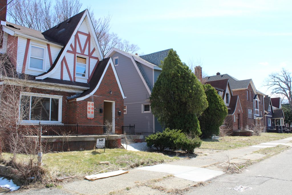 homes on a street boarded up LH