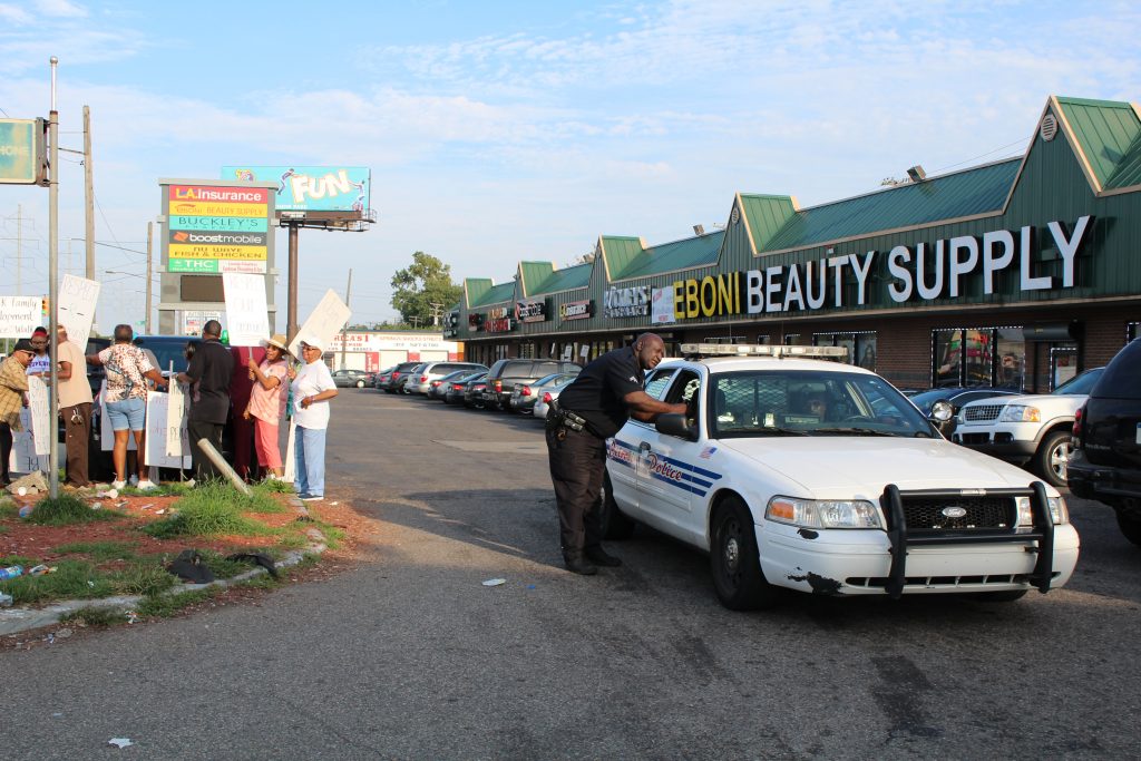 Police Car Protest Gas Station LH