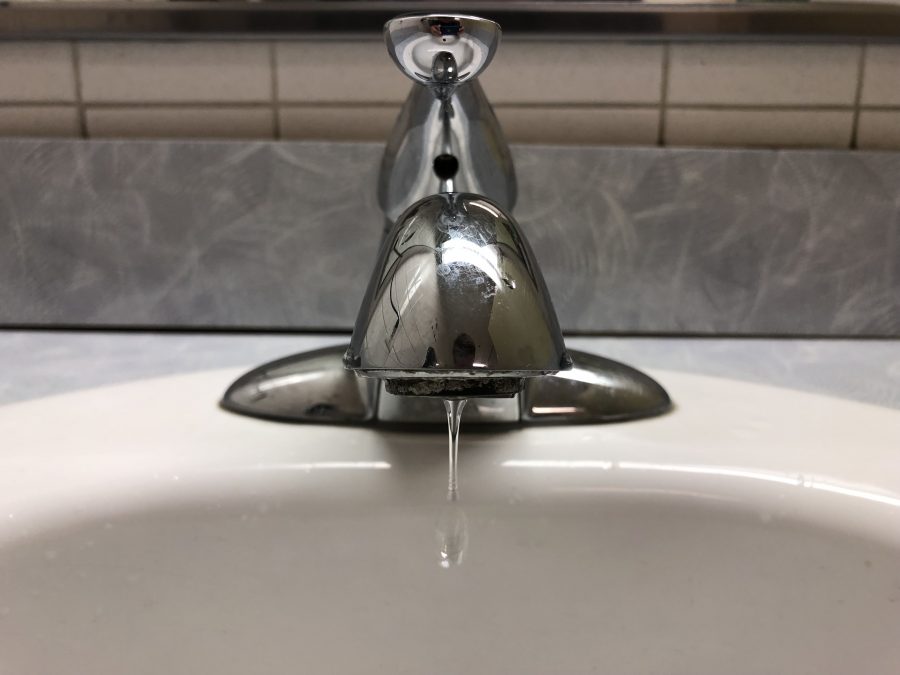 Photo of water dripping from a faucet.