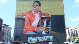 A mural of Stevie Wonder on the side of a building in Detroit