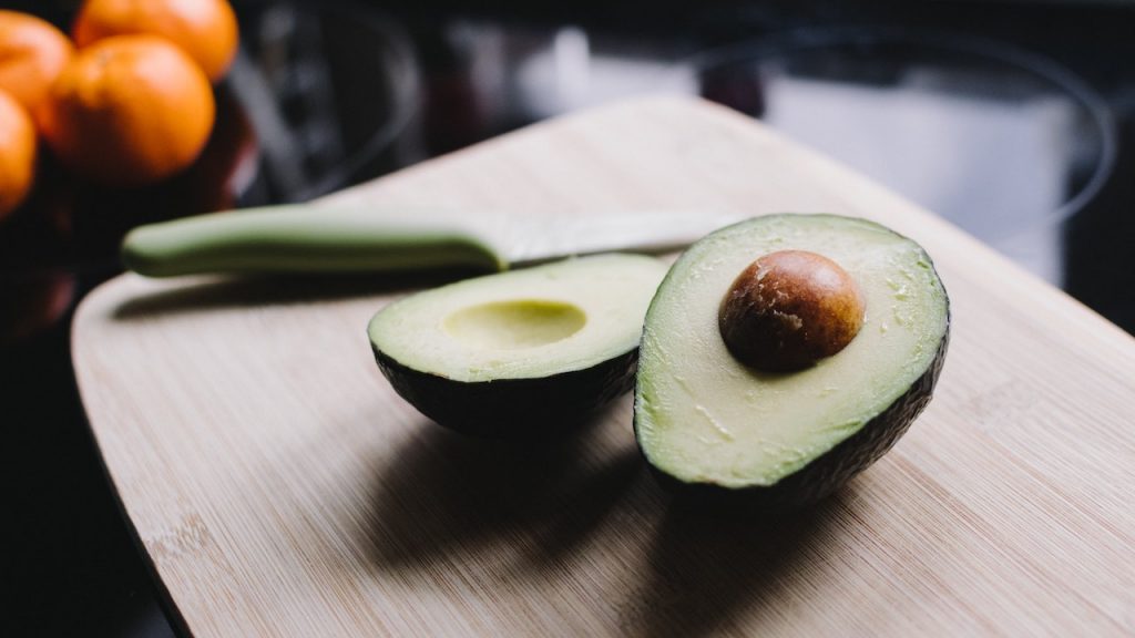 Avocados and knife on Cutting Board