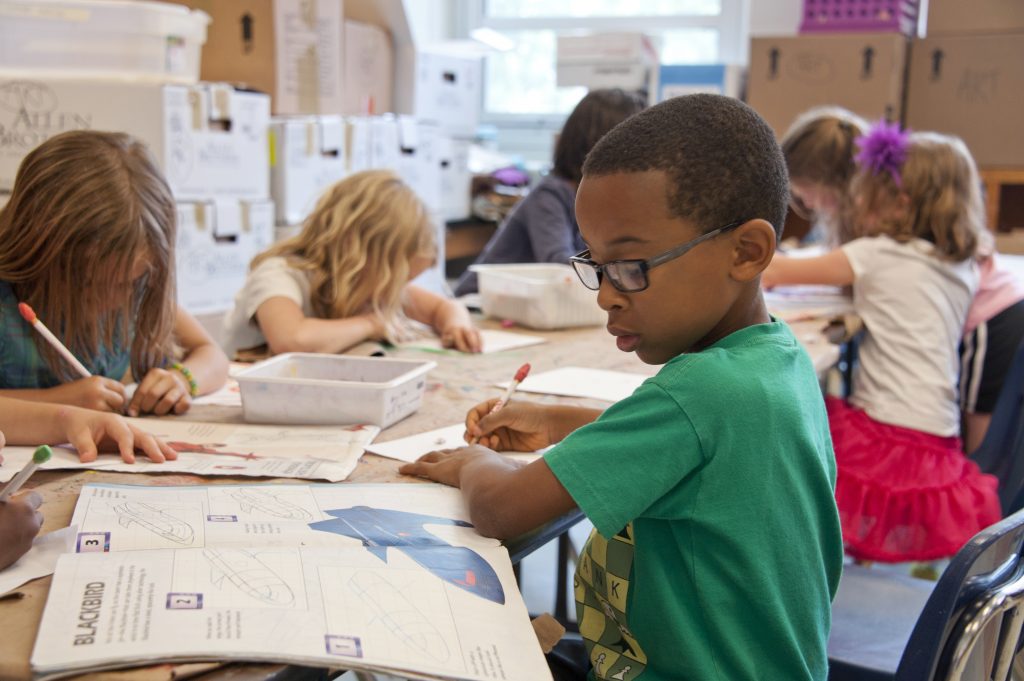 child in elementary school classroom