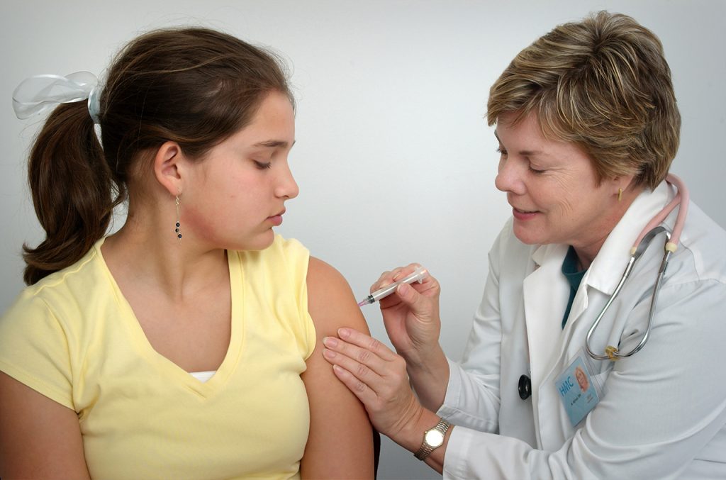 Kid receiving a vaccine