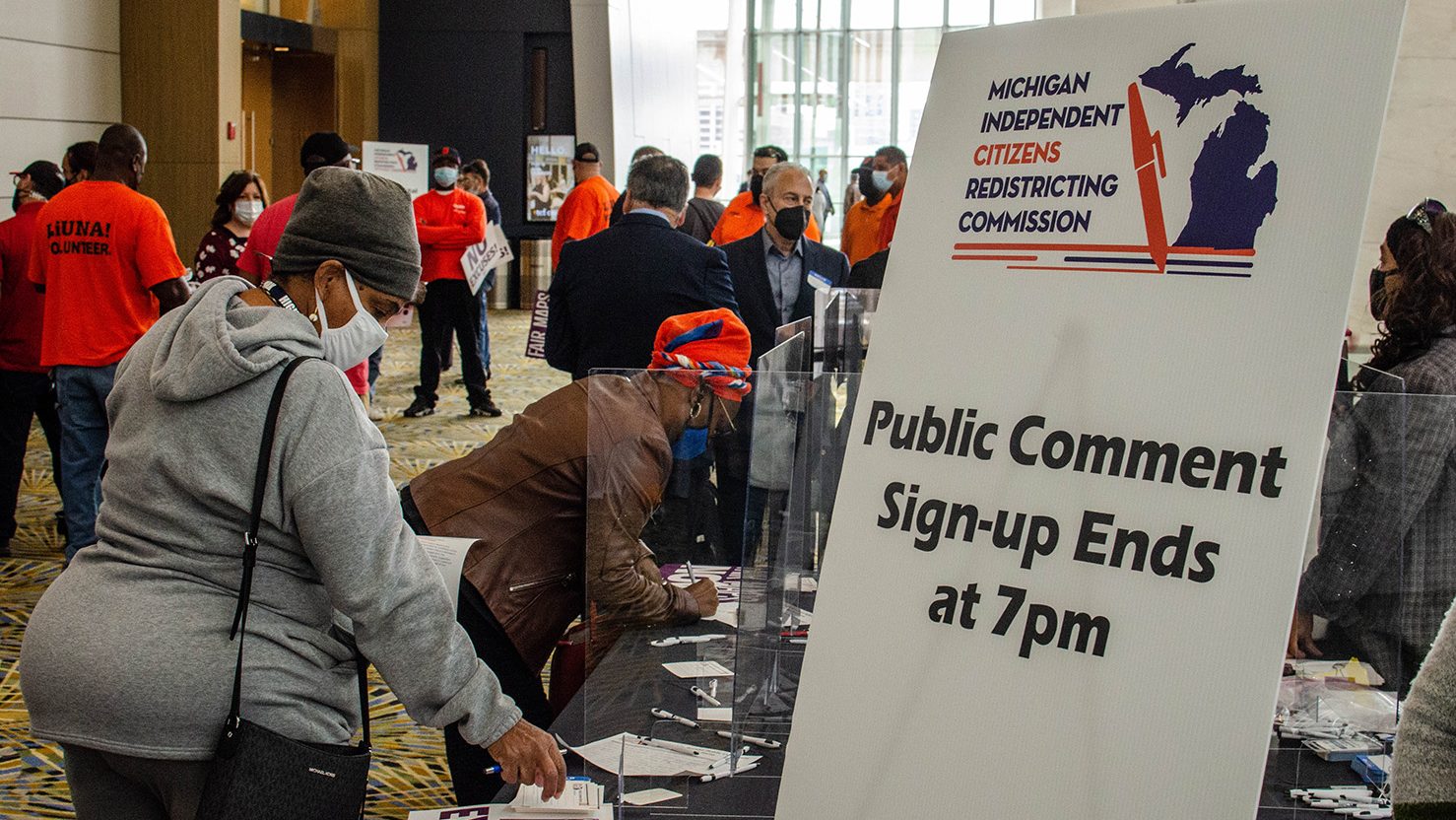 Detroit-area residents sign up for a public comment period at a Michigan Independent Citizens Redistricting Commission meeting at Huntington Place on Oct. 20, 2021.