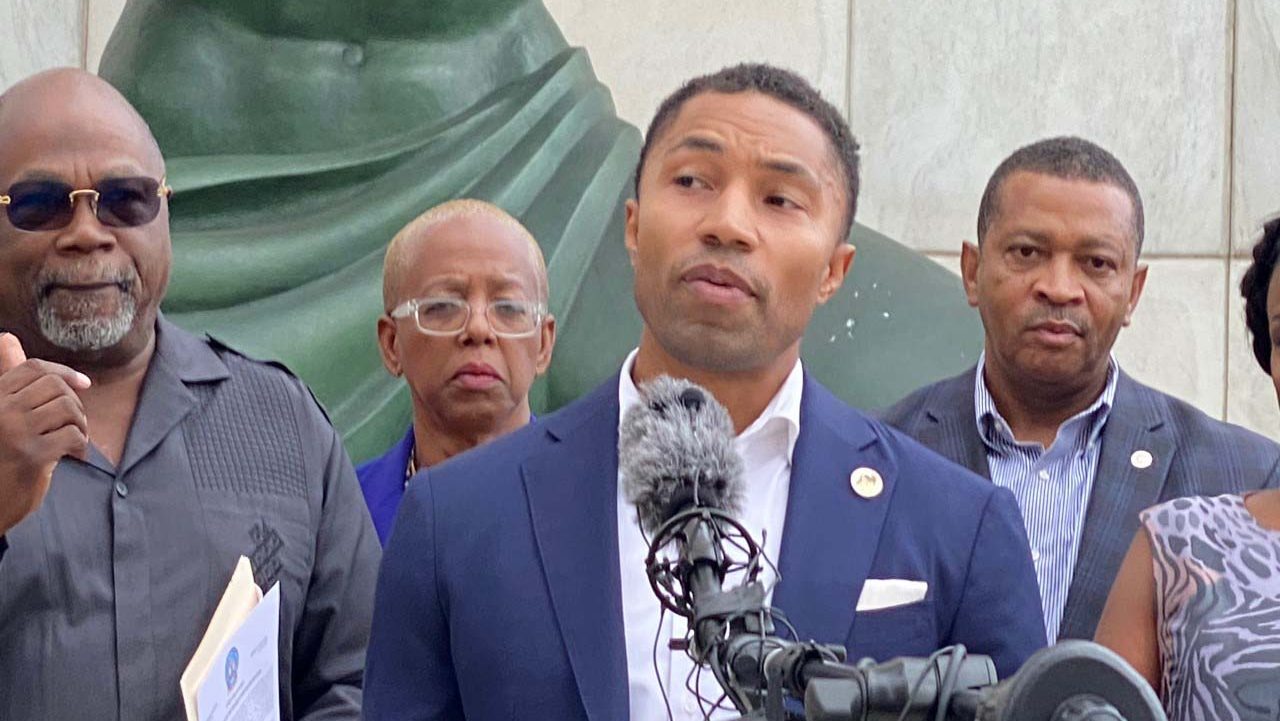 FILE - Former state Sen. Adam Hollier attends a press conference with other Detroit lawmakers and activists regarding the redistricting of Michigan Congressional maps, Oct. 12, 2021.