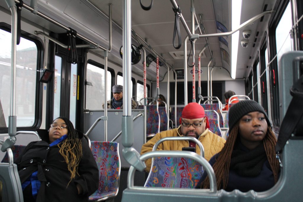 interior of a buss with passengers