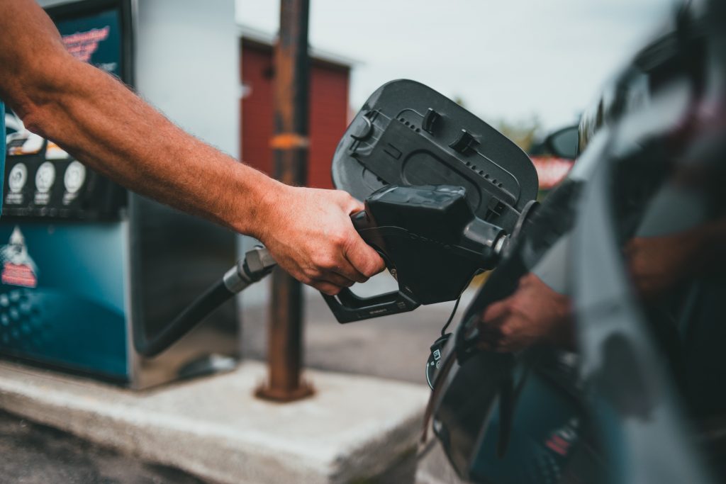 driver filling up gas tank