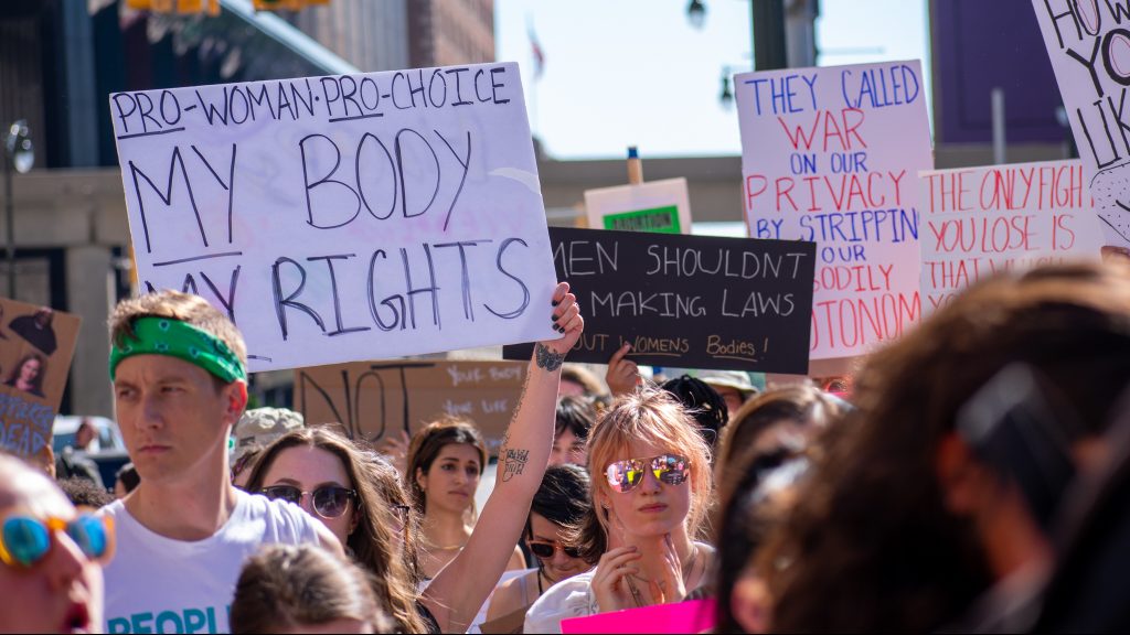 An abortion rights supporter holds up a sign that says "My Body My Rights" during a protest