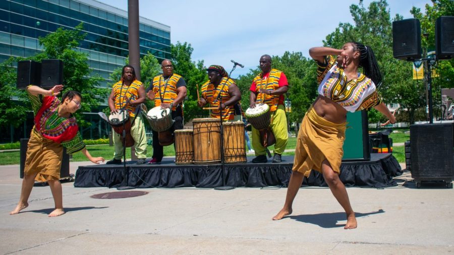Shayla Tyler (left) and Allimatou Coleman perform a traditional West African dance during the Wayne State University Juneteenth kickoff event, on Jun. 13, at Wayne State University, in Detroit.