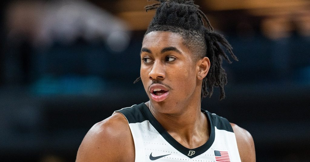 Detroit Pistons draft pick guard Jaden Ivey adjusts his cap before