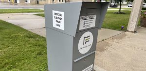 A gray election drop box for submitting absentee ballots