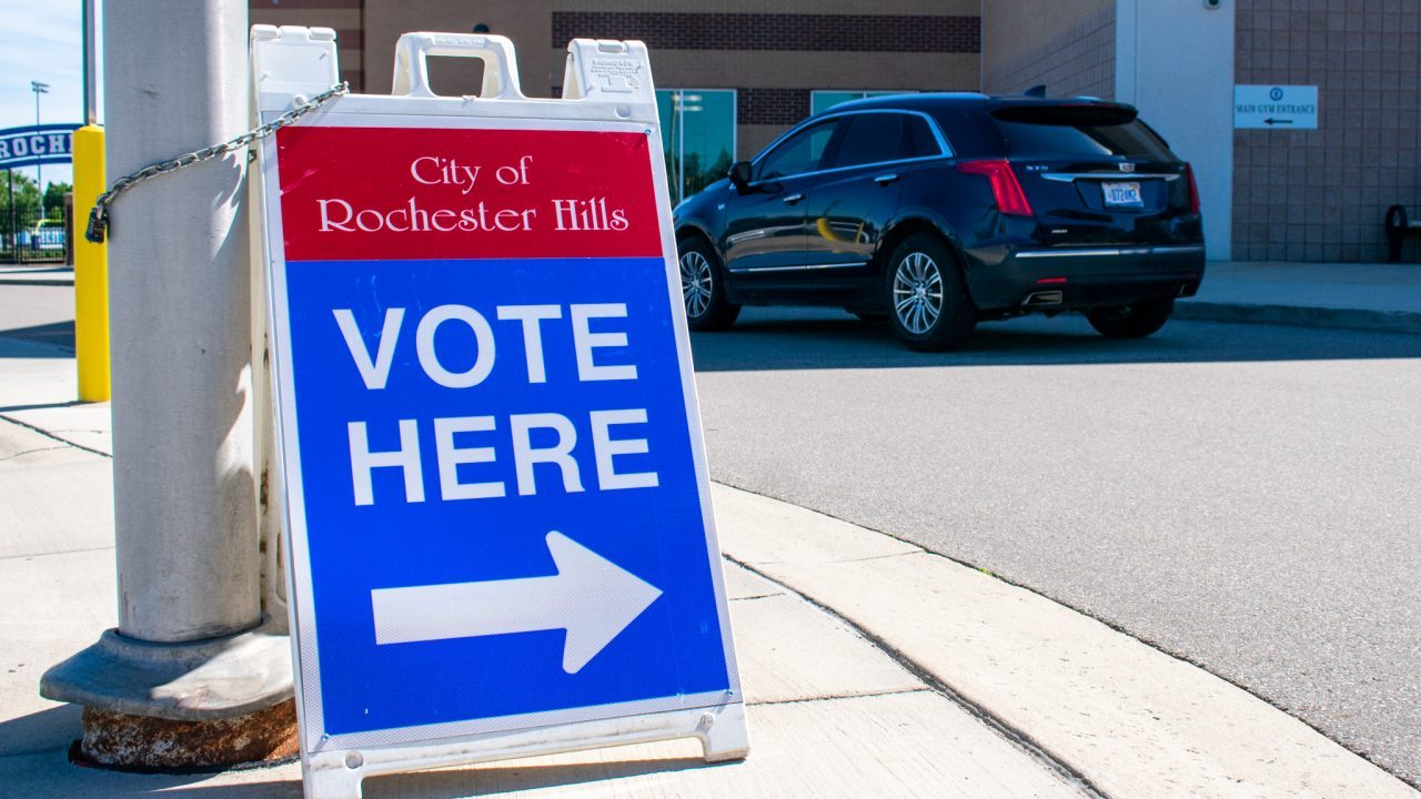 Sign telling voters where to vote at polling booth in Rochester Hills, Mich.