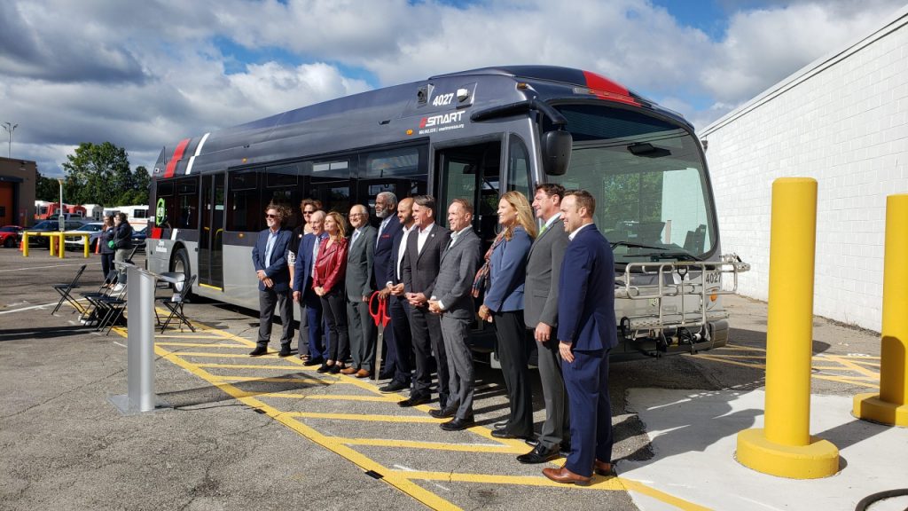 A crew stands in front of one of the new Proterra SMART Electric Buses in September 2022.