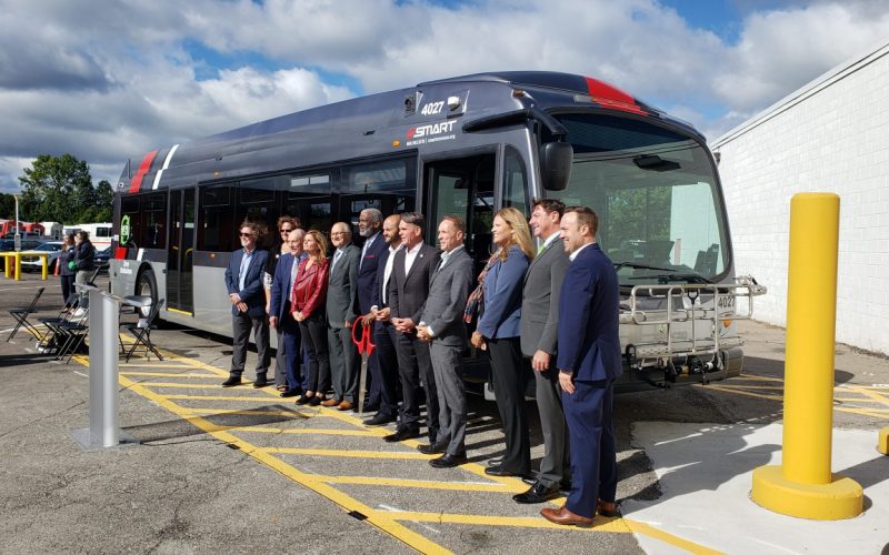 A crew stands in front of one of the new Proterra SMART Electric Buses in September 2022.