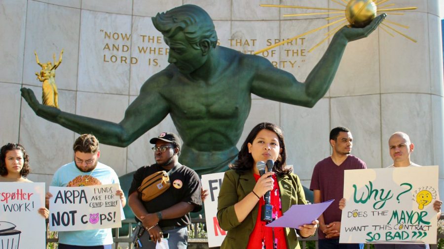 People gather around the Spirit of Detroit landmark to protest the use of ShotSpotter.
