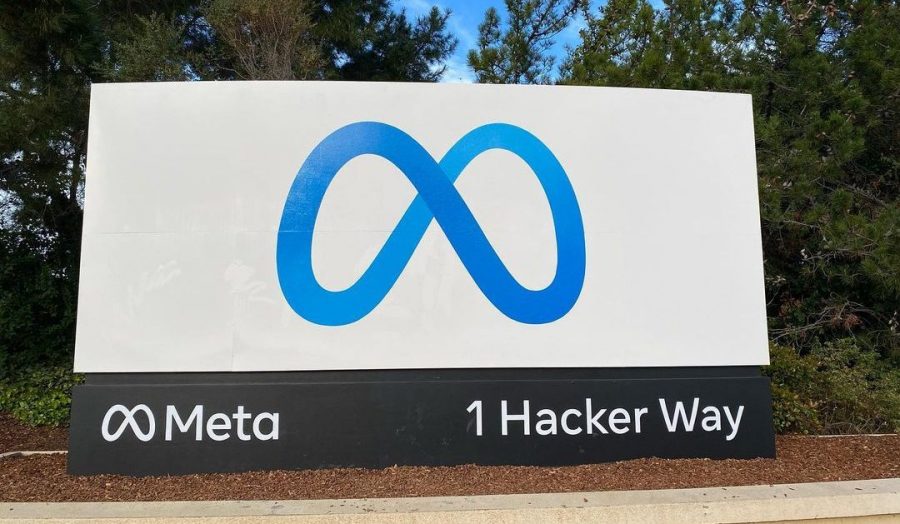 entrance sign to the Meta headquarters with a blue logo
