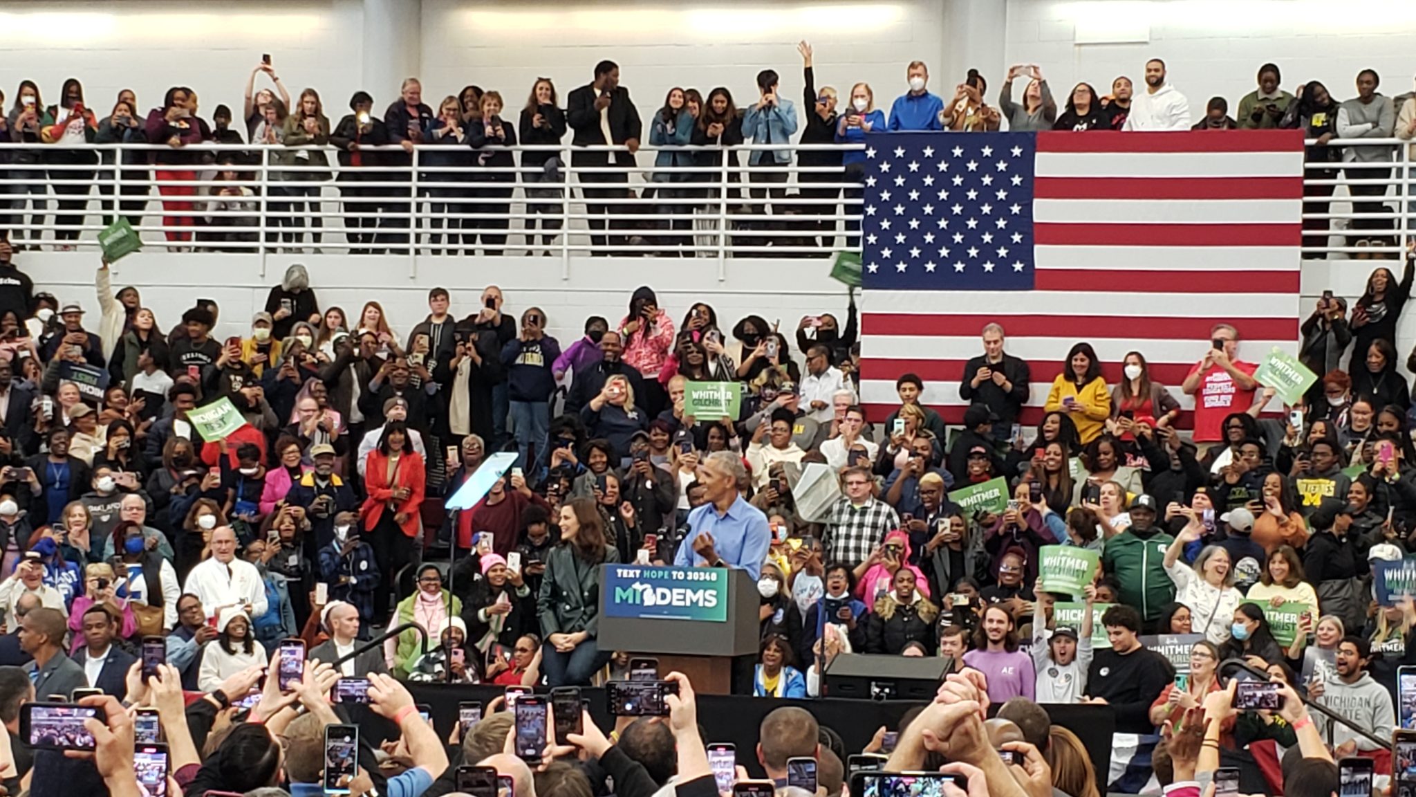 Former President Barack Obama speaks to a crowd of supporters.