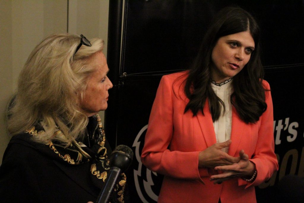 Haley Stevens speaks with Debbie Dingell at Oakland University in 2022