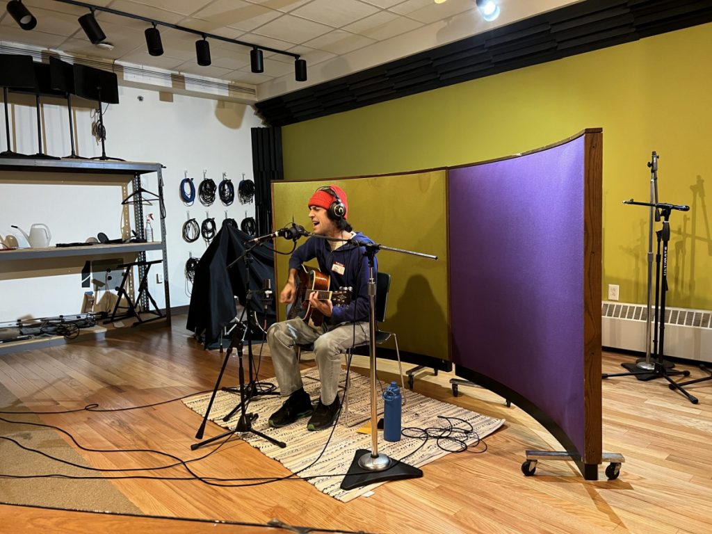 jeffrey thomas sings and plays an acoustic guitar in WDET's live studio