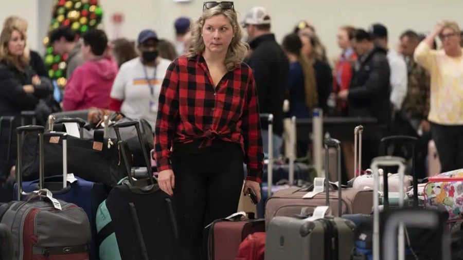 Ashlyn Harmon of New Orleans searches for her Southwest Airlines bags amongst hundreds of others at Midway International Airport as Southwest continues to cancel thousands of flights across the country Wednesday, Dec. 28, 2022, in Chicago.