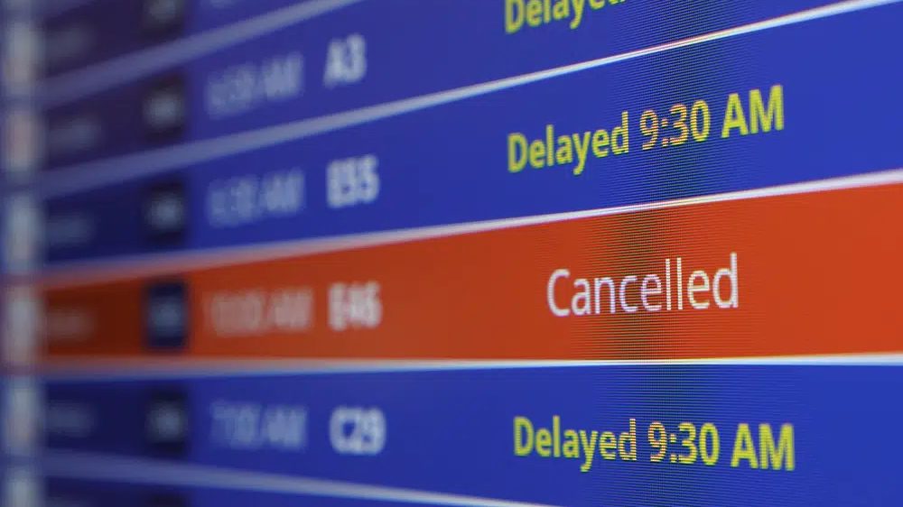 A video board shows flight delays and cancellations at Ronald Reagan Washington National Airport in Arlington, Va., Wednesday, Jan. 11, 2023.