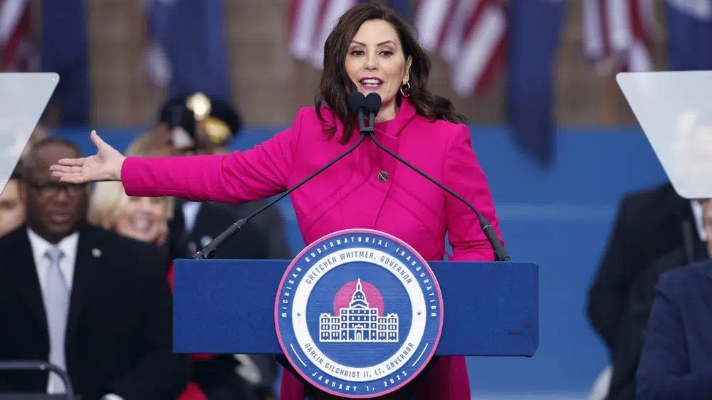 Michigan Gov. Gretchen Whitmer addresses the crowd during inauguration ceremonies, Sunday, Jan. 1, 2023, outside the state Capitol in Lansing, Mich.