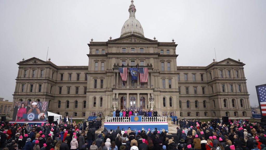 Imam Mohammad Ali Elahi delivers a prayer during inauguration ceremonies, Sunday, Jan. 1, 2023, outside the state Capitol in Lansing, Mich.