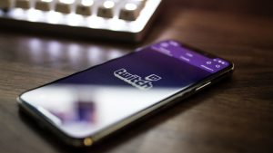 smartphone on a desk with the Twitch app open
