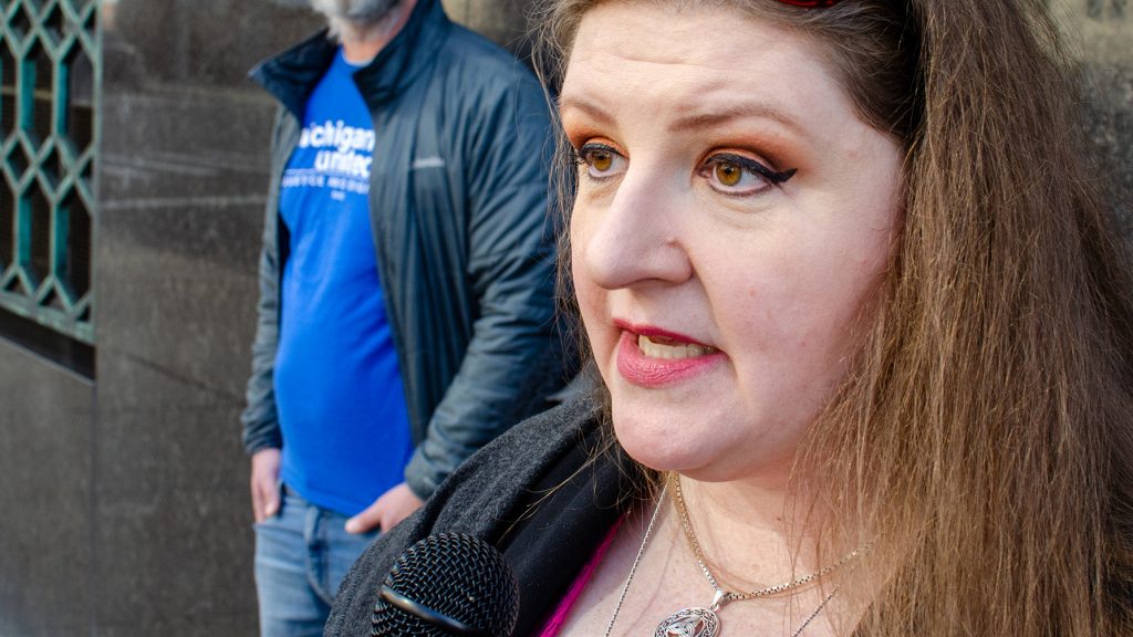 Flint resident and water crisis activist Melissa Mays speaks to WDET outside the Theodore Levin U.S. Courthouse in downtown Detroit on Feb. 15, 2023.