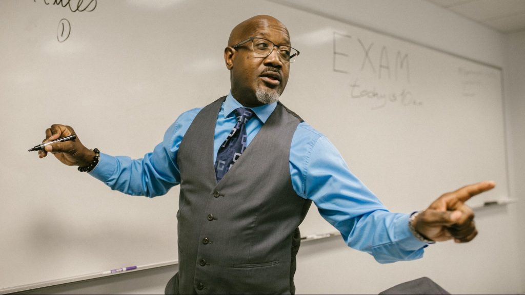 Photo of a teacher explaining the rules before an exam.