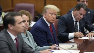 Former President Donald Trump sits at the defense table with his legal team in a Manhattan court, Tuesday, April 4, 2023, in New York. Trump is appearing in court on charges related to falsifying business records in a hush money investigation, the first president ever to be charged with a crime.