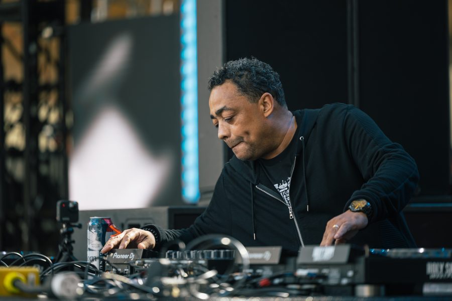Electronic musician Delano Smith works a turntable onstage at Movement 2022.