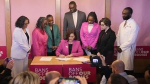 Michigan Gov. Gretchen Whitmer signs legislation to repeal the 1931 abortion ban statute, which criminalized abortion in nearly all cases during a bill signing ceremony, Wednesday, April 5, 2023, in Birmingham, Mich.
