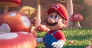 Still of Mario surrounded by mushrooms from the Super Mario Bros Movie (2023).