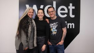 Ann Delisi, Paulina Schemanski and James Rigato smile in front of the WDET studios