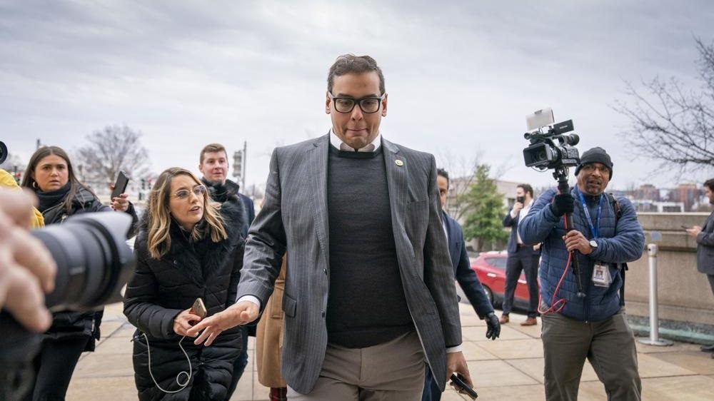 Rep. George Santos, R-N.Y., leaves a House GOP conference meeting on Capitol Hill in Washington, Jan. 25, 2023. Santos has been arrested on federal criminal charges. The Republican congressman has faced outrage over revelations he fabricated parts of his life story, including lying about being a wealthy Wall Street dealmaker. Santos was arrested Wednesday.