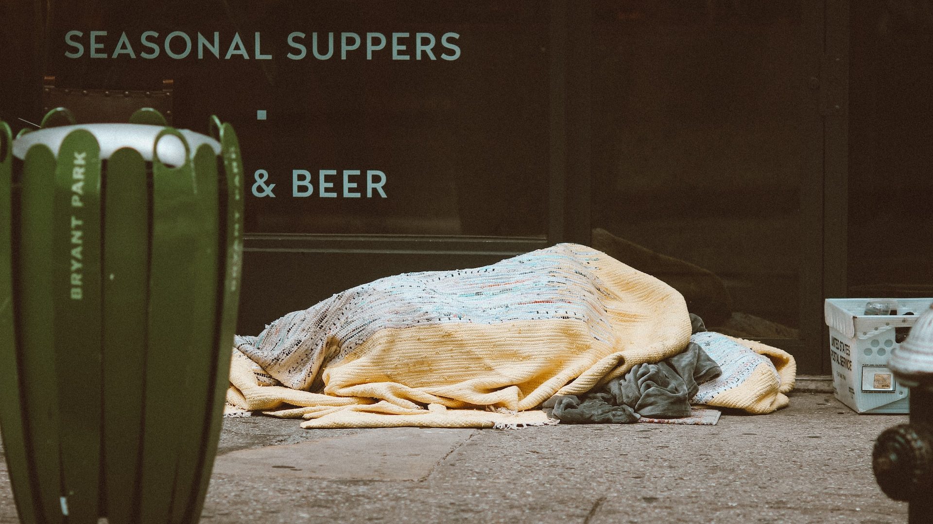 Homeless person sleeping outside.