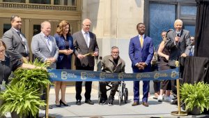 State and Detroit city officials join Bedrock executives, including billionaire Dan Gilbert, in celebrating the reopening of the Book Tower.