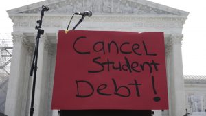 A sign reading “cancel student debt” is seen outside the Supreme Court, Friday, June 30, 2023, as decisions are expected in Washington.