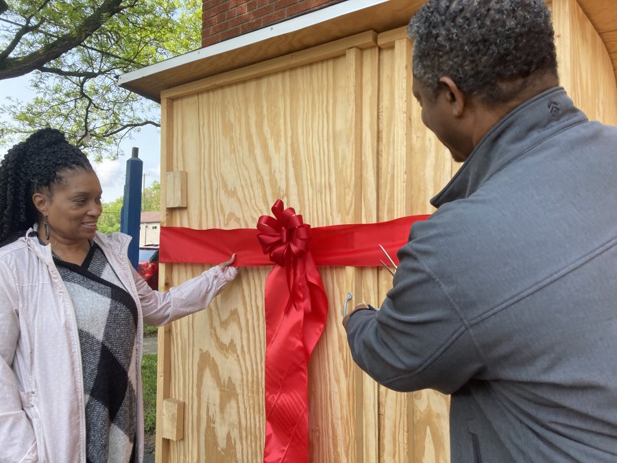 Blanton L. Banks and wife Kimberly cut the ribbon to officially open the community refrigerator.