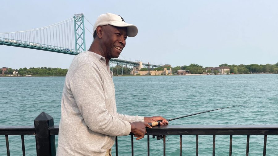 Bo Keyes fishes in the Detroit River.