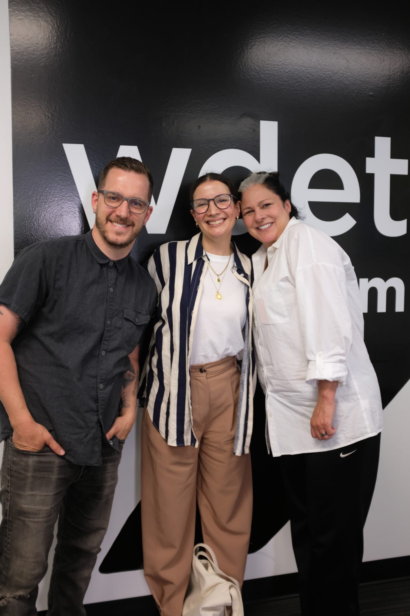 Warda Bouguettaya (middle) poses with "Essential Cooking" hosts Ann Delisi and Chef James Rigato at WDET's studios.